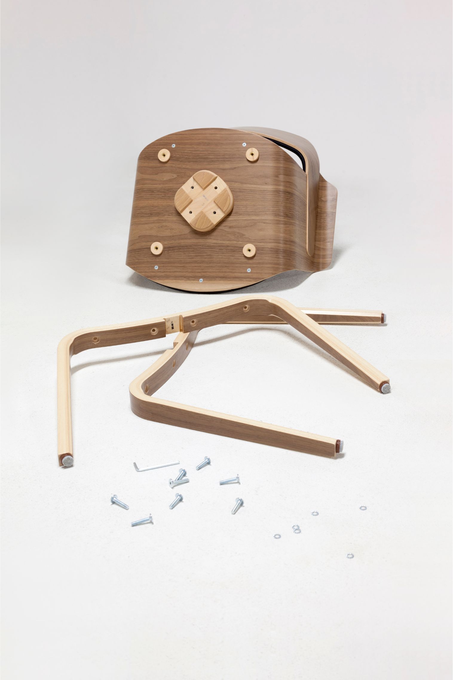 Disassembled armchair in American walnut plywood