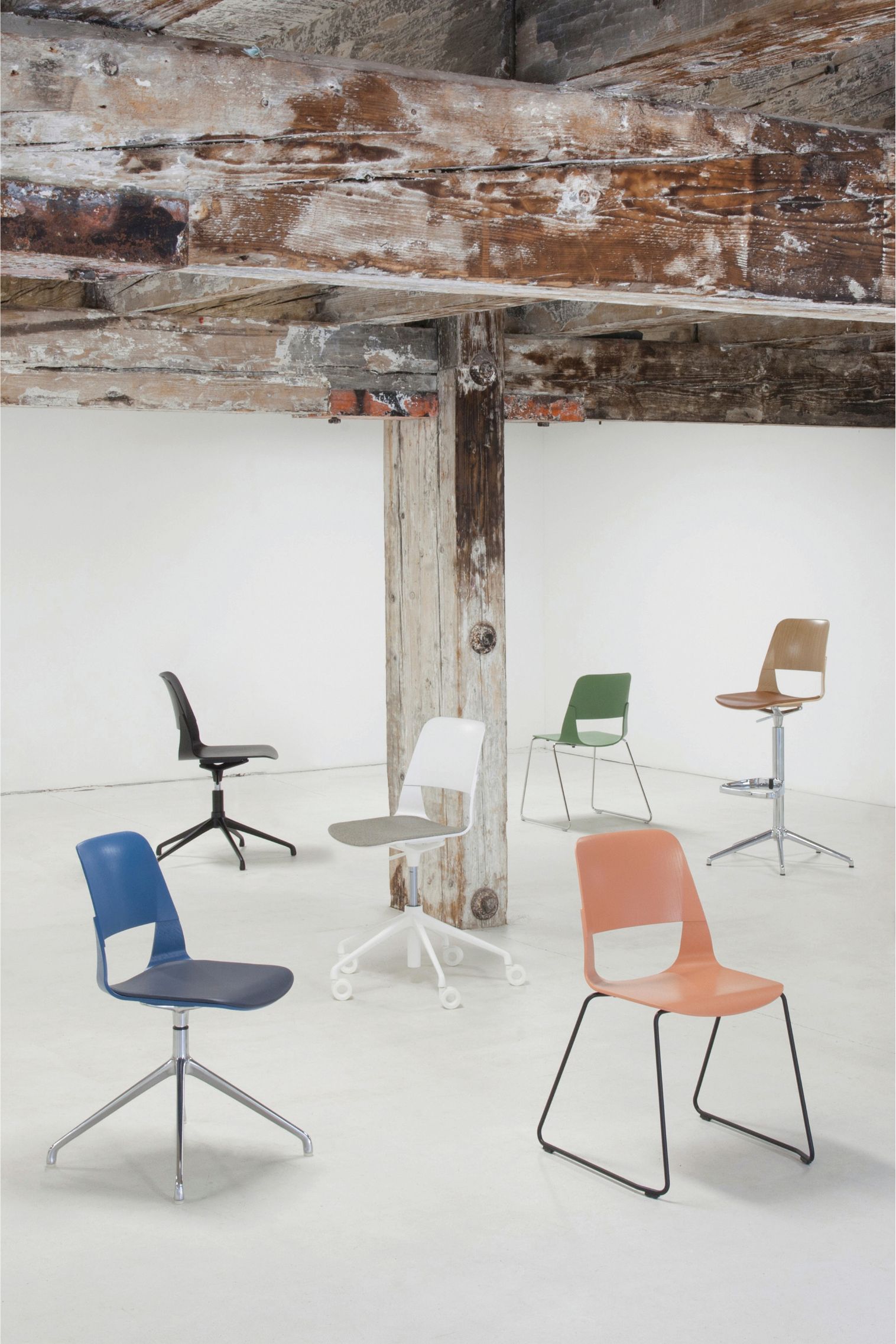 Coloured chairs with different leg structures (sled base, swivel base, wooden leg, heightened leg with footrest).